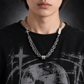 Model wearing Samvee men's layered silver Double Cross and Lucky Bead necklace