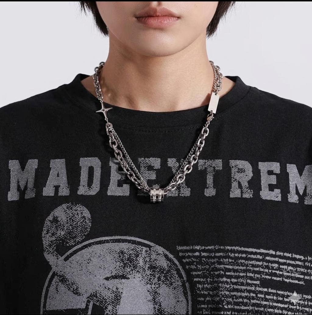 Model wearing Samvee men's layered silver Double Cross and Lucky Bead necklace