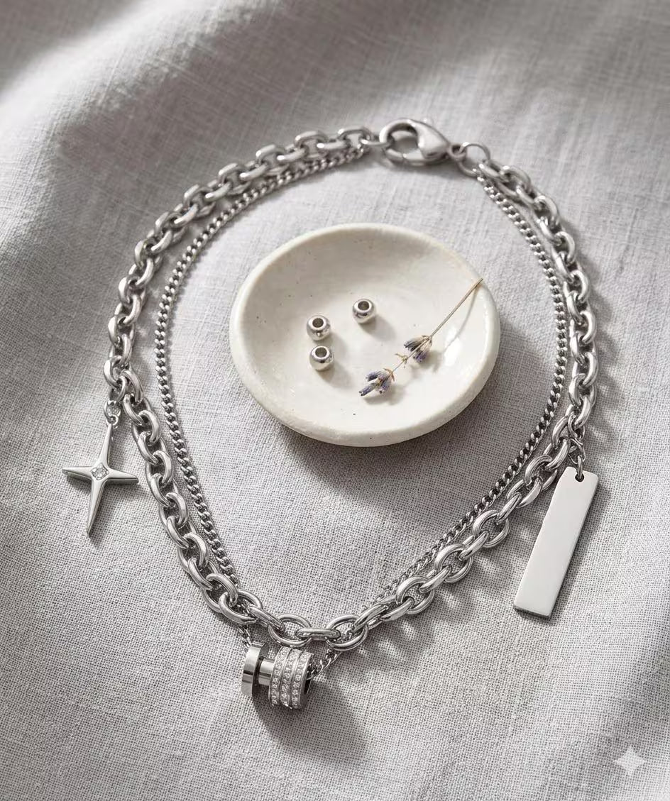 Close-up of Samvee Double Cross and Lucky Bead necklace details